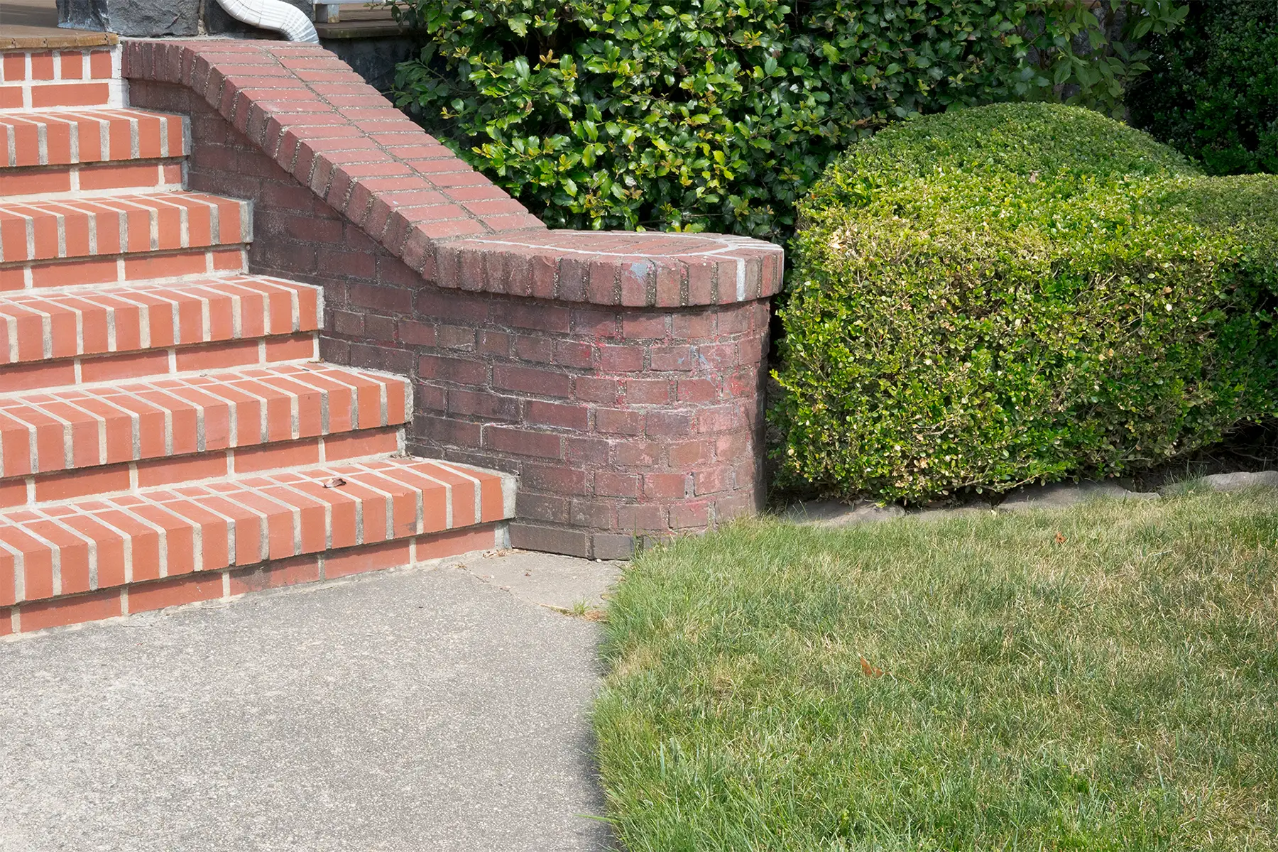 Mismatching brick work at the entrance to a home in Brooklyn, NY.