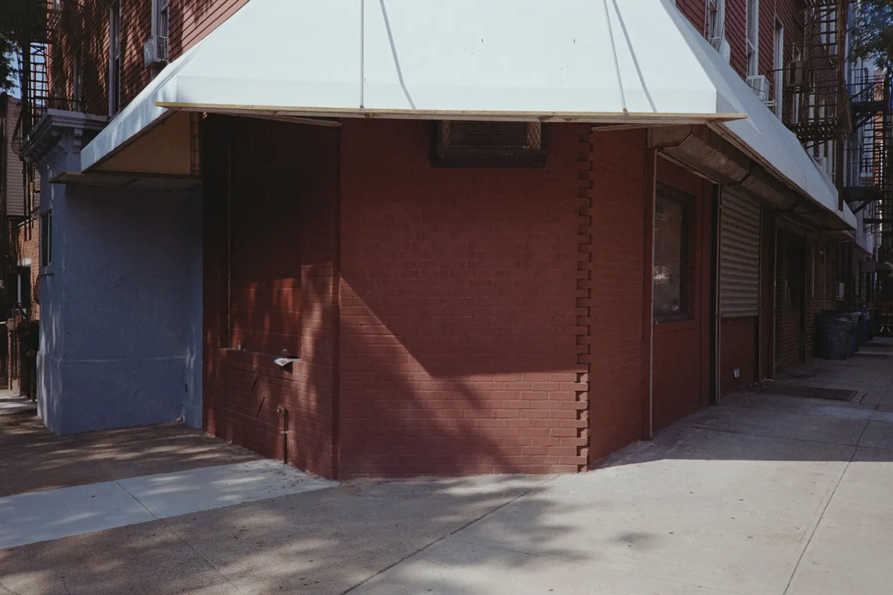 The corner of a now closed store front in Greenpoint, Brooklyn, NY.